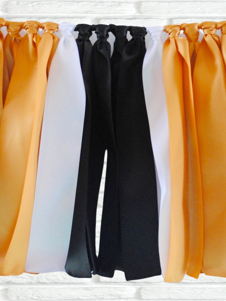 Gold black white ribbon bunting - The Party Teacher - hero image