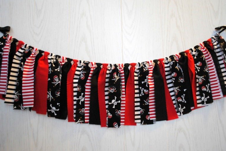 red and black striped pirate party decoration with skull and crossbones