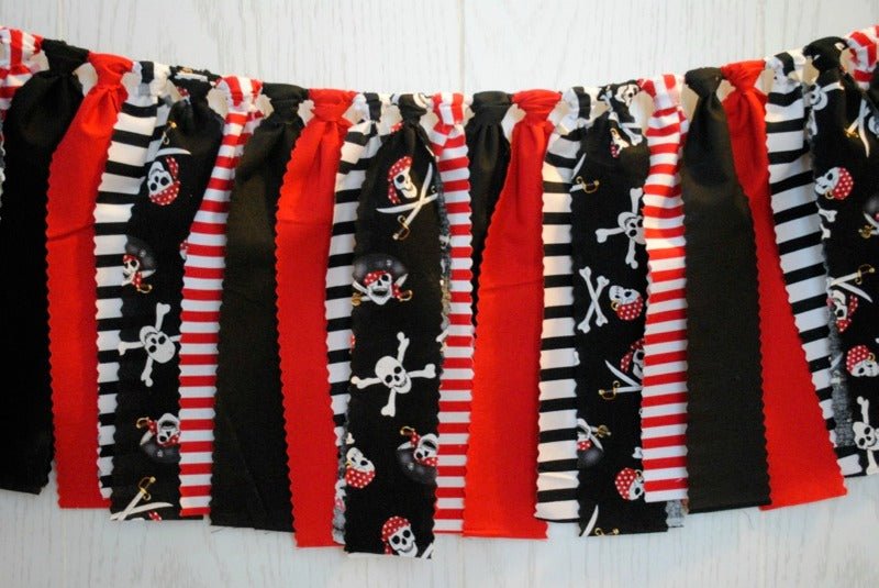 Detailed view of a pirate banner featuring alternating red, black, and white stripes